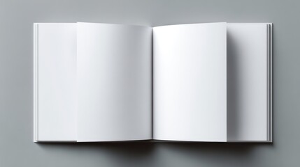 Open book with white blank pages, centered on a grey surface, ready for content