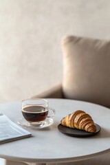 Morning cup of coffee with croissant in a cozy interior. 