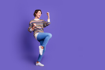 Photo of lovely pretty woman wear stylish clothes celebrate success empty space isolated on purple color background
