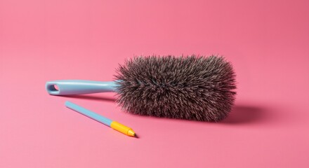 Blue Cleaning Brush with Short Handle on Pink Background