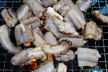 roasting hagfish (sea eel) on the charcoal grill