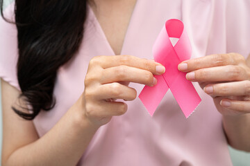 Asian woman with pink ribbon, World Breast Cancer Day at October.