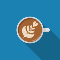 Top down view of a white ceramic coffee cup and saucer