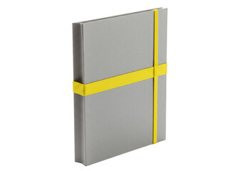 A closed grey notebook with a bright yellow elastic band securing it presented isolated on transparent background