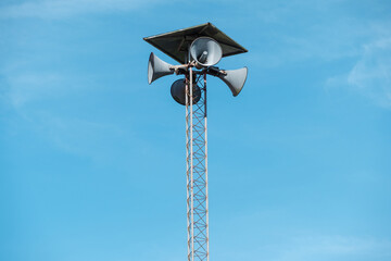 Public Loudspeaker Tower Outdoors with Blue Sky