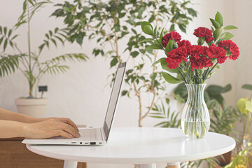 Woman hands typing on the laptop.
