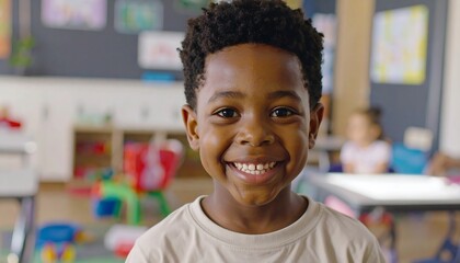 A smiling young boy in a classroom