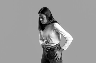 Wman suffering from stomach pain. Intestinal and stomach problems concept. Black and white
