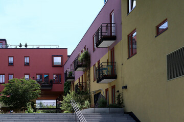 New colorful appartment buildings with greened balconies and inner courtyard in the city (Oslo, Norway)