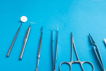 Detailed macro shot showing stainless steel dental instruments on a pure white background.