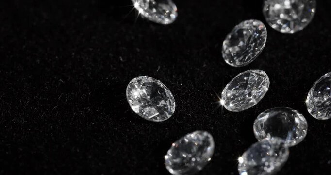 Jewelry zirconia stones on a dark background. Artificial gemstones on a rotating table.