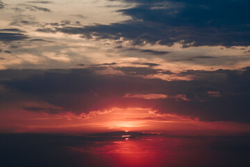 A captivating sunset image showcasing a fiery sky filled with rich red and orange hues. 