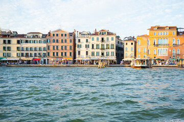 Exploring the scenic canals of Venice, Italy with family during summer vacation in August 2025