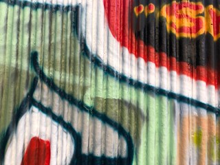 Textured 3d wall red and green street-art graffiti paint wallpaper background web texture