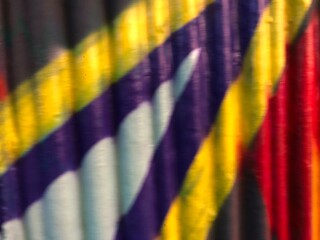 Textured 3d wall red, yellow, purple, black  street-art graffiti paint wallpaper background web texture
