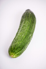 Fresh green cucumber isolated on a white background.
