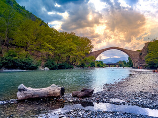 Traditional Stone Bridge in Konitsa The Grand Single Arch Bridge at the Entrance of Aoos Gorge Historic Landmark and Scenic Nature in Greece Featuring Picturesque Views and Cultural Significance