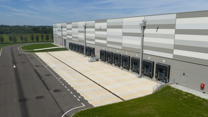 Truck dock platform logistics warehouse empty space door for loading and unloading goods.