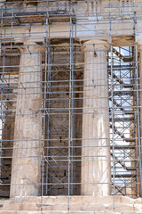 Ancient Acropolis columns in Athens under restoration with scaffolding, historic Greek architecture and cultural heritage preservation site.
