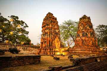 Wat Mahathat, Ayutthaya, houses the relics of Lord Buddha. It features sandstone Buddha head covered with roots of a Bodhi tree, unique and beautiful sight that has become renowned as another wonder.