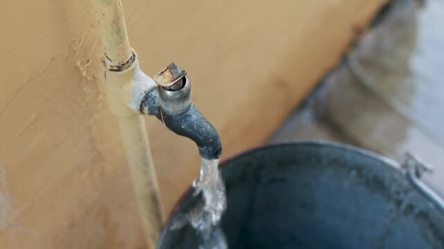 Water Filling Steel Bucket from Tap &ndash; Rural Scarcity
