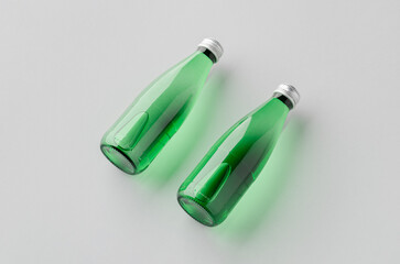 Small water bottle mockup, green glass