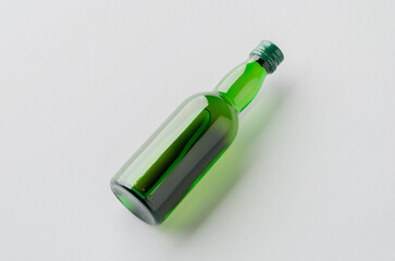 Miniature spirits, liquor bottle mockup, green glass.