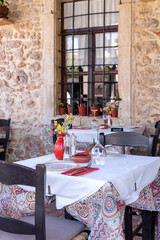 Traditional greek table setting at a restaurant, taverna in Crete Greece