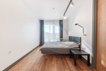 Modern Minimalist Bedroom with Wooden Floor and Large Window