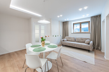 Modern Home Living Room with Sofa and Dining Table Decorated Sofa in Background