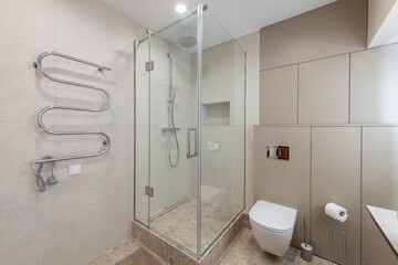 Modern Bathroom With Tiled Floor and Glass Shower Enclosure