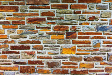 Colorful stone wall useful for backgrounds. Stone wall texture