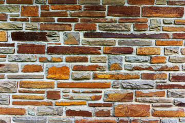 Colorful stone wall useful for backgrounds. Stone wall texture