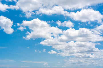 Obraz premium Beautiful bright and clear blue sky with scattered clouds.
