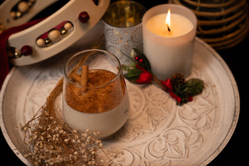 Rompope celebrating christmas with traditional mexican eggnog drink and festive decorations
