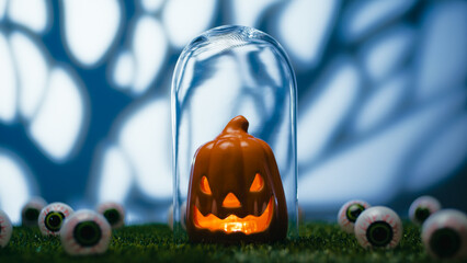 Halloween Pumpkin Amidst Scary Eyes On The Grass