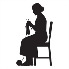 Silhouette of an elderly woman sitting on a chair knitting a garment with wool and needles