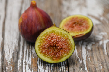 Fresh figs on old wooden table in village setting