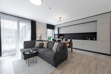 Modern Kitchen Interior with Wooden Dining Table and Leather Chairs