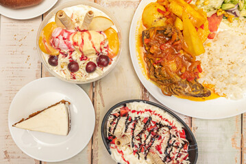 Chocolo arepas with melted country cheese, accompanied by homemade hogao and sparkling Santafereño hot chocolate in a clay cup