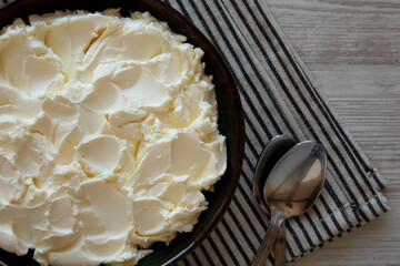 Organic White Mascarpone Cheese in a Bowl, top view.