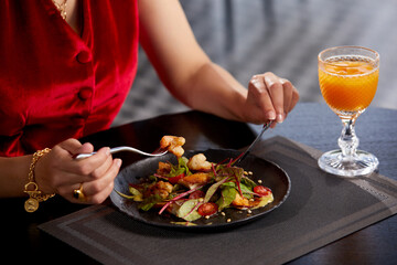 Cropped view of woman eating fresh salad for lunch in luxury restaurant, Healthy lifestyle, diet...