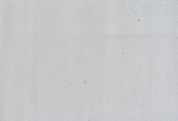 Rough, textured concrete wall surface, showing aggregate and subtle color variations, stone, surface