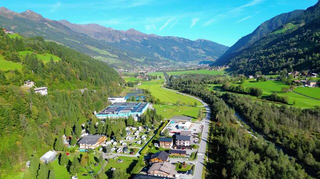 Scenic aerial view of Kurcamping Erlengrund near Bad Gastein, surrounded by alpine valley, mountains and lush green nature