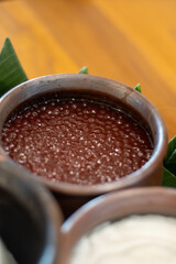 Indonesian traditional bubur mutiara tapioca pearl dessert in clay bowl