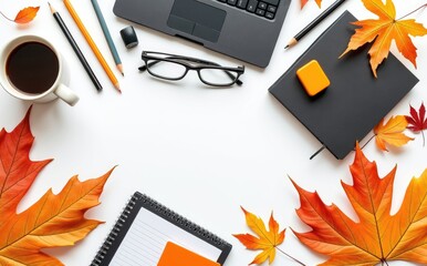 Autumn leaves desk arrangement with coffee and laptop image