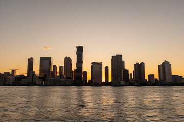 Silhouette of Hoboken, New Jersey from the water.