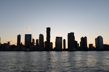 Silhouette of Hoboken, New Jersey from the water.