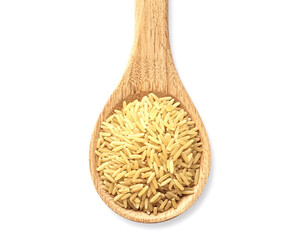 Scoop golden brown rice with wooden spoon for healthy eating and balanced diet culinary concept