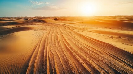 Desert Sunset: Golden Sands and Tire Tracks